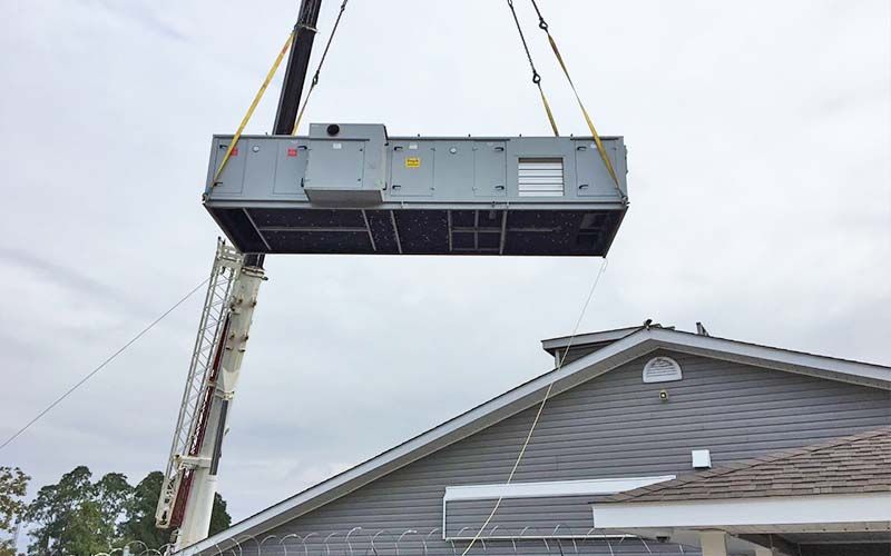 Unit being craned onto a roof